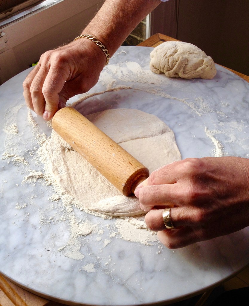 take sections of dough and begin to roll into a circle